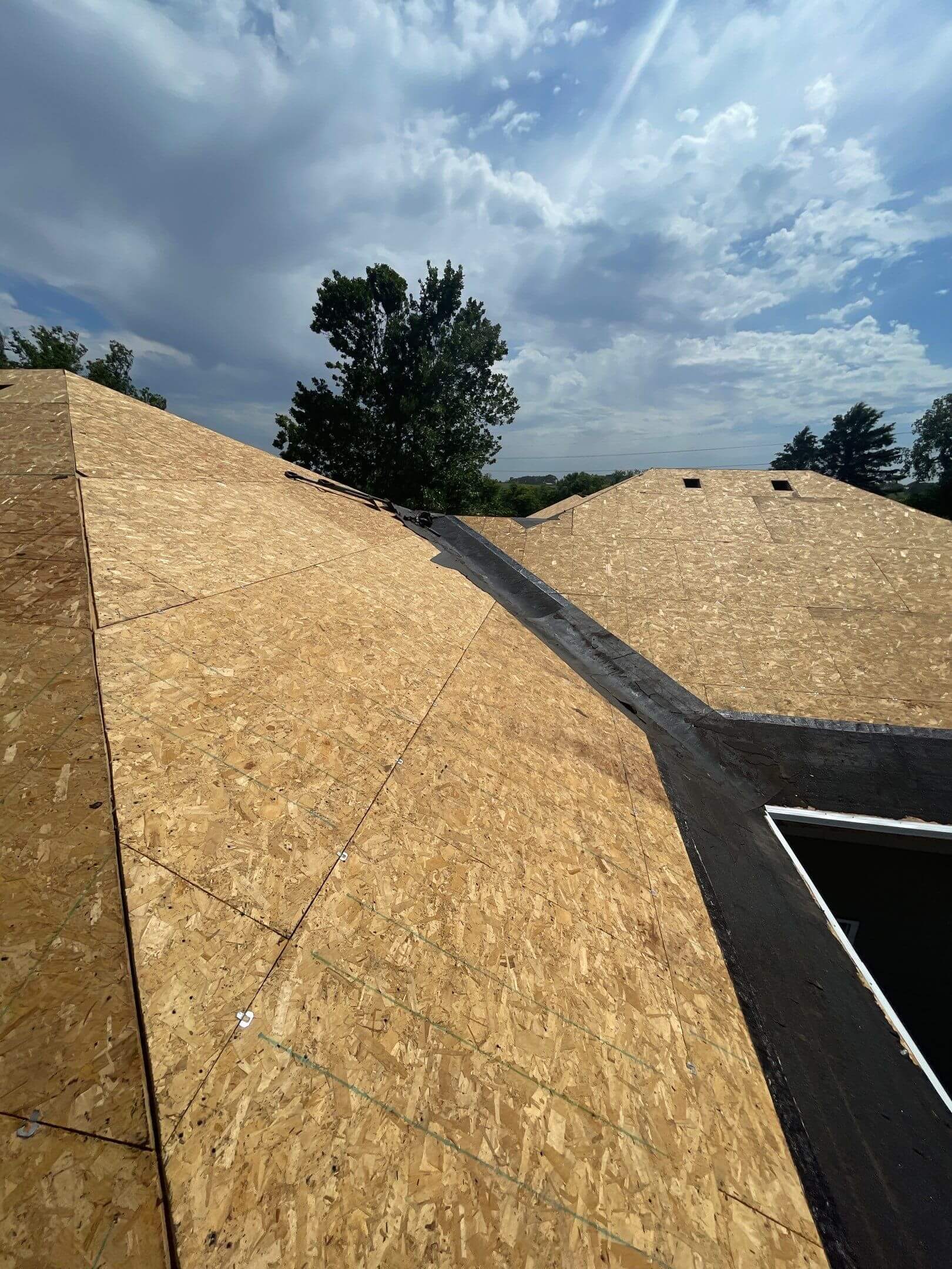 A-before Before image of residential roof showing aging shingles and visible wear prior to replacement by Wegner Roofing